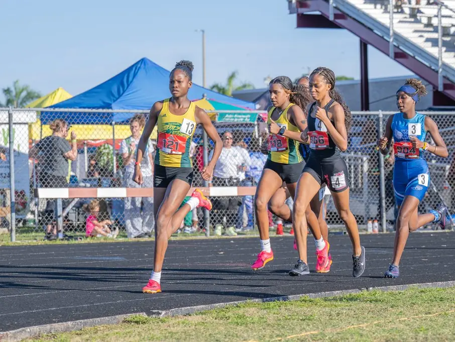 Runners charging down the track