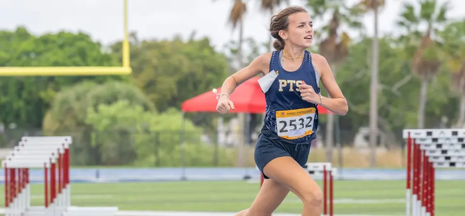 Hurdler from PTS running between hurdles